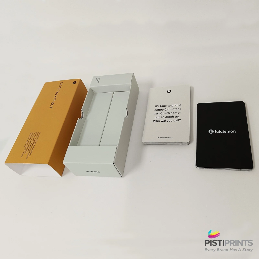 Branded custom packaging and printed cards by Lululemon, showcasing how custom packaging enhances brand recognition and customer experience.