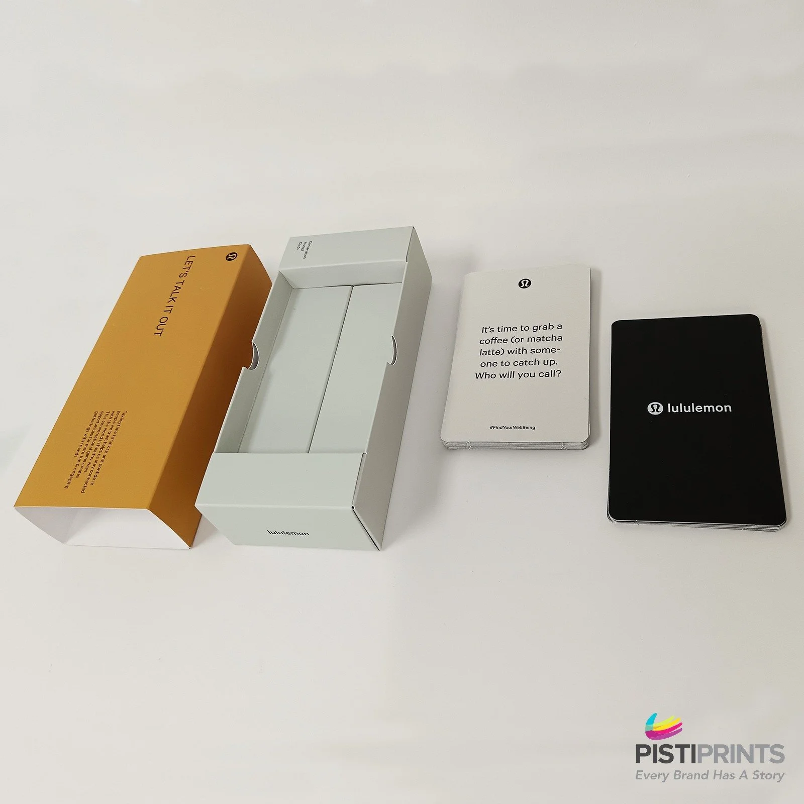 Branded custom packaging and printed cards by Lululemon, showcasing how custom packaging enhances brand recognition and customer experience.