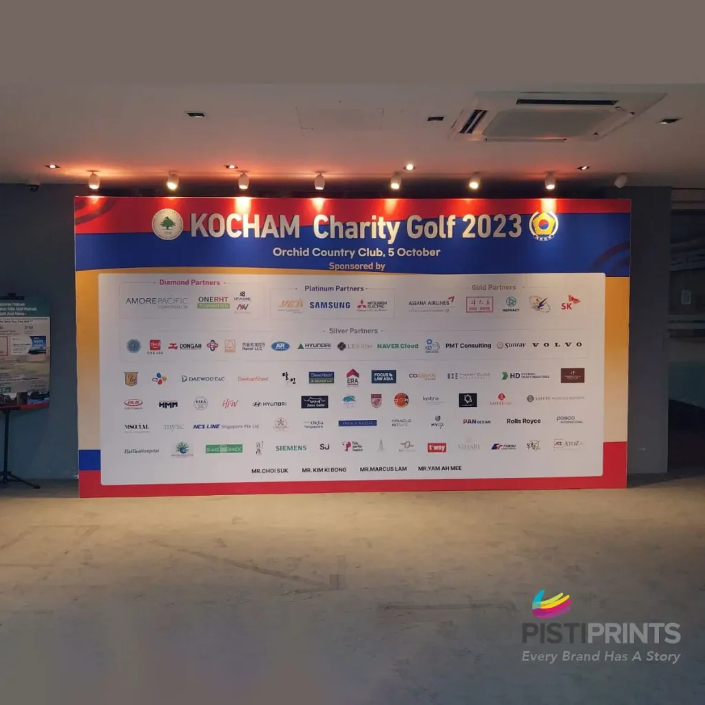 Event-ready backdrop printing for KOCHAM Charity Golf 2023 at Orchid Country Club in Singapore, featuring sponsor logos and branding.