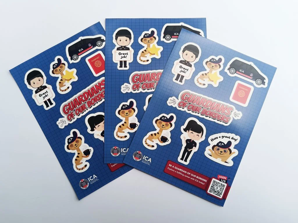 Sheets of colorful custom laptop stickers featuring cartoon characters, cars, and text designs with the title "Guardians of Our Borders," showcasing creative sticker design ideas for personal and business use.