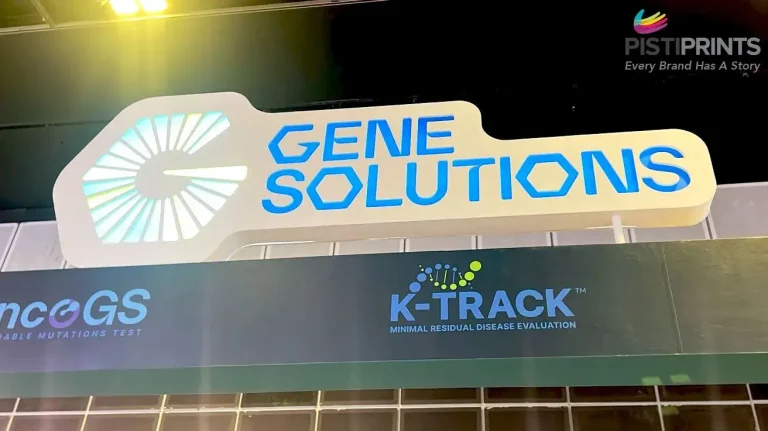 Illuminated 3D signage for Gene Solutions and K-Track, showcasing custom-built signage design and installation for business branding.
